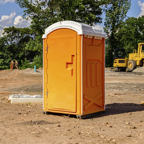 what is the cost difference between standard and deluxe porta potty rentals in Calamus